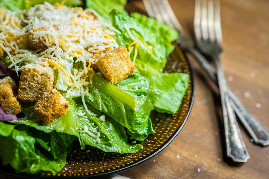 caesar-salad-on-rustic-background