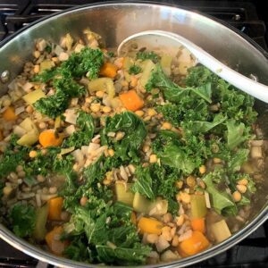 lentil-soup-with-greens in a pot