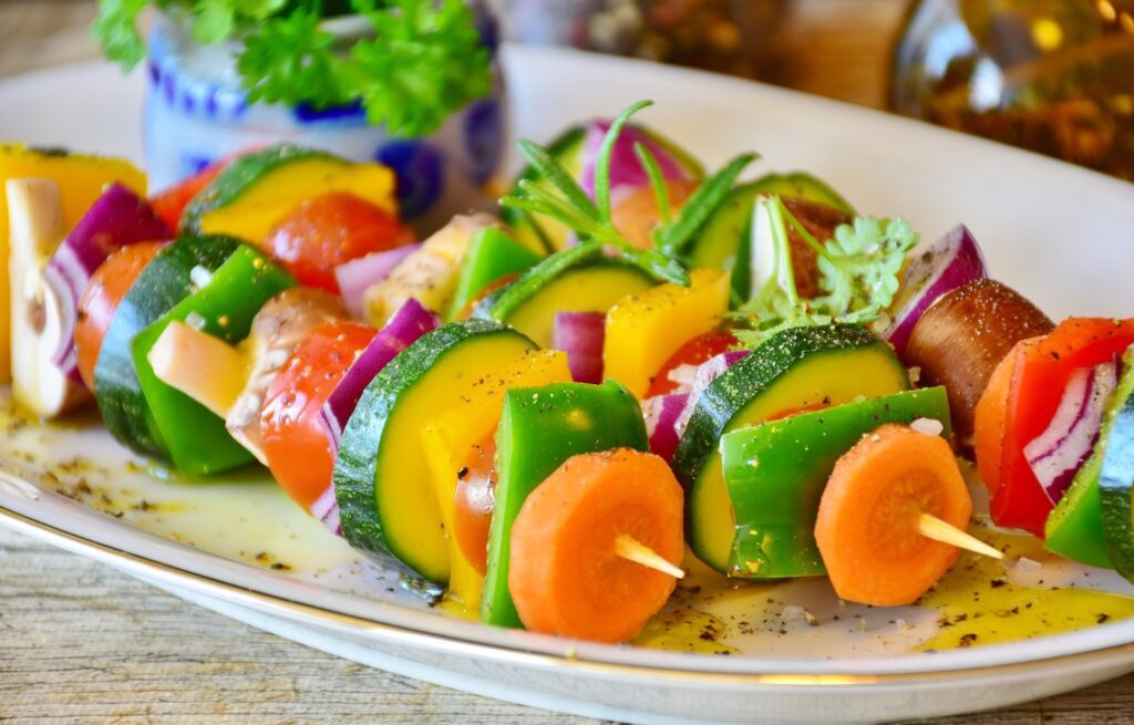 Vegetable skewers with carrots, peppers, zucchini and other vegetables on a skewer