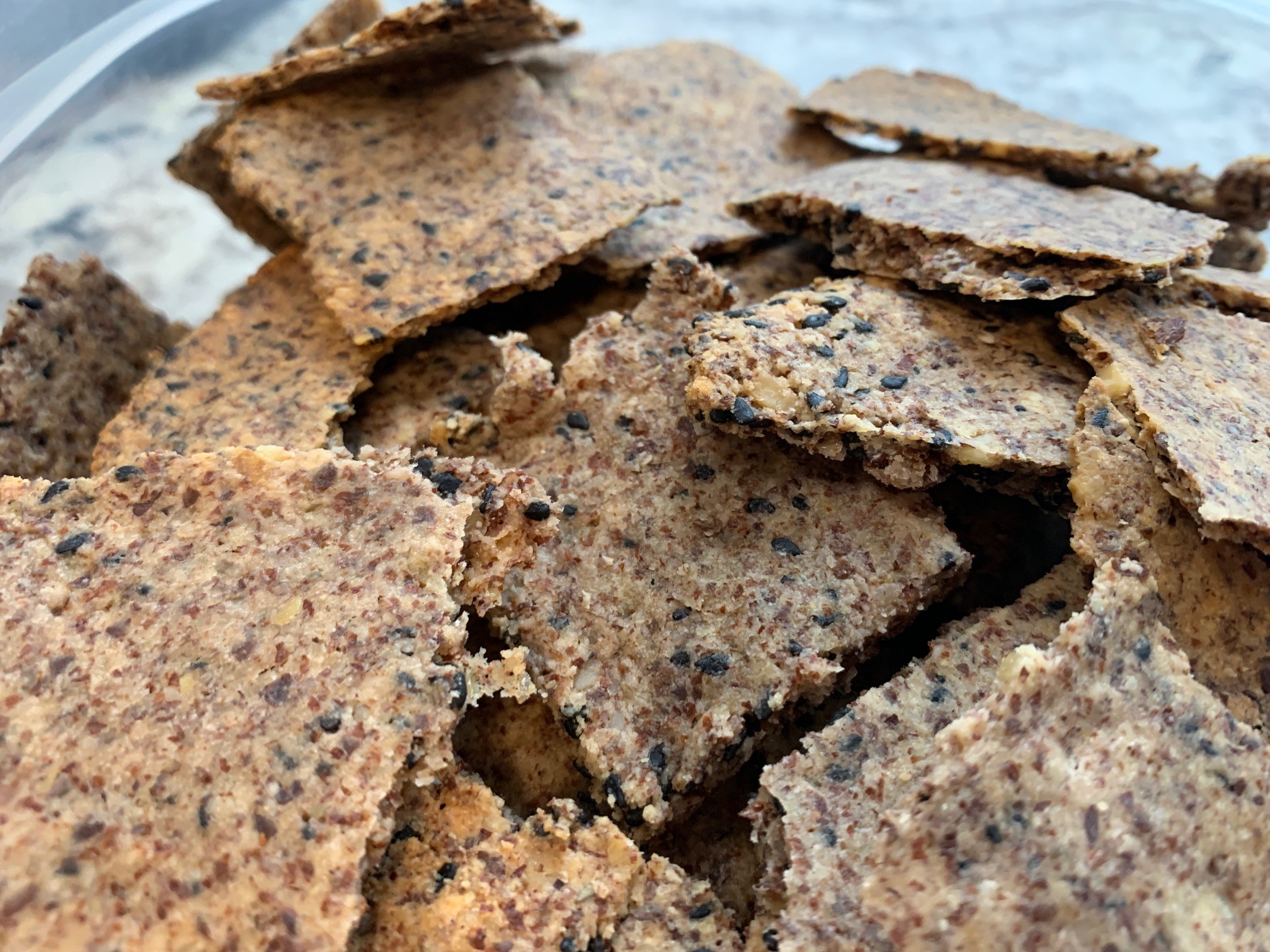 a bowl of sesame flax crackers